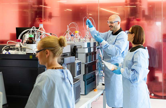 Team members working in a lab