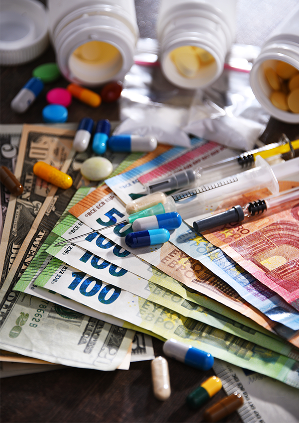 Pile of money and pharmaceuticals