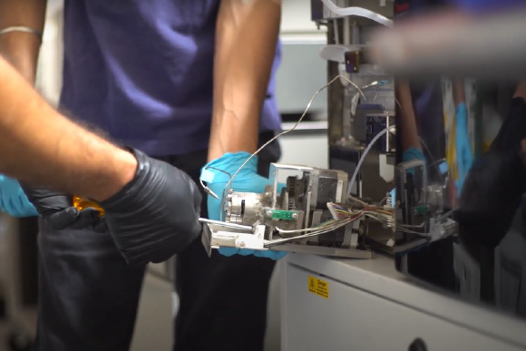 Engineers working on an LCMS system